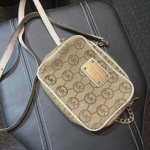 Michael Kors Brown Crossbody Bag with Slim Profile and Durable Fabric